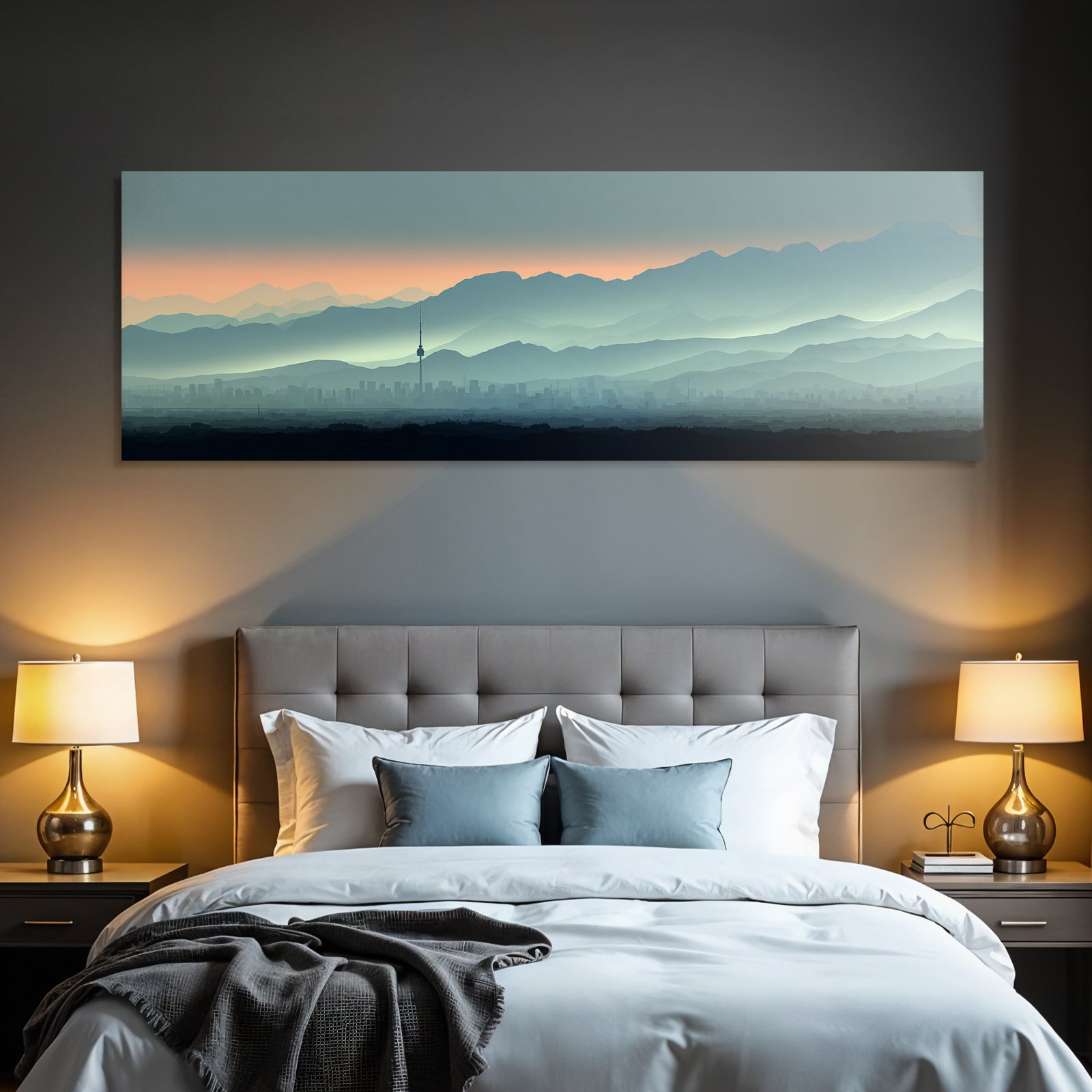 Cityscape with tower and mountain backdrop at sunrise