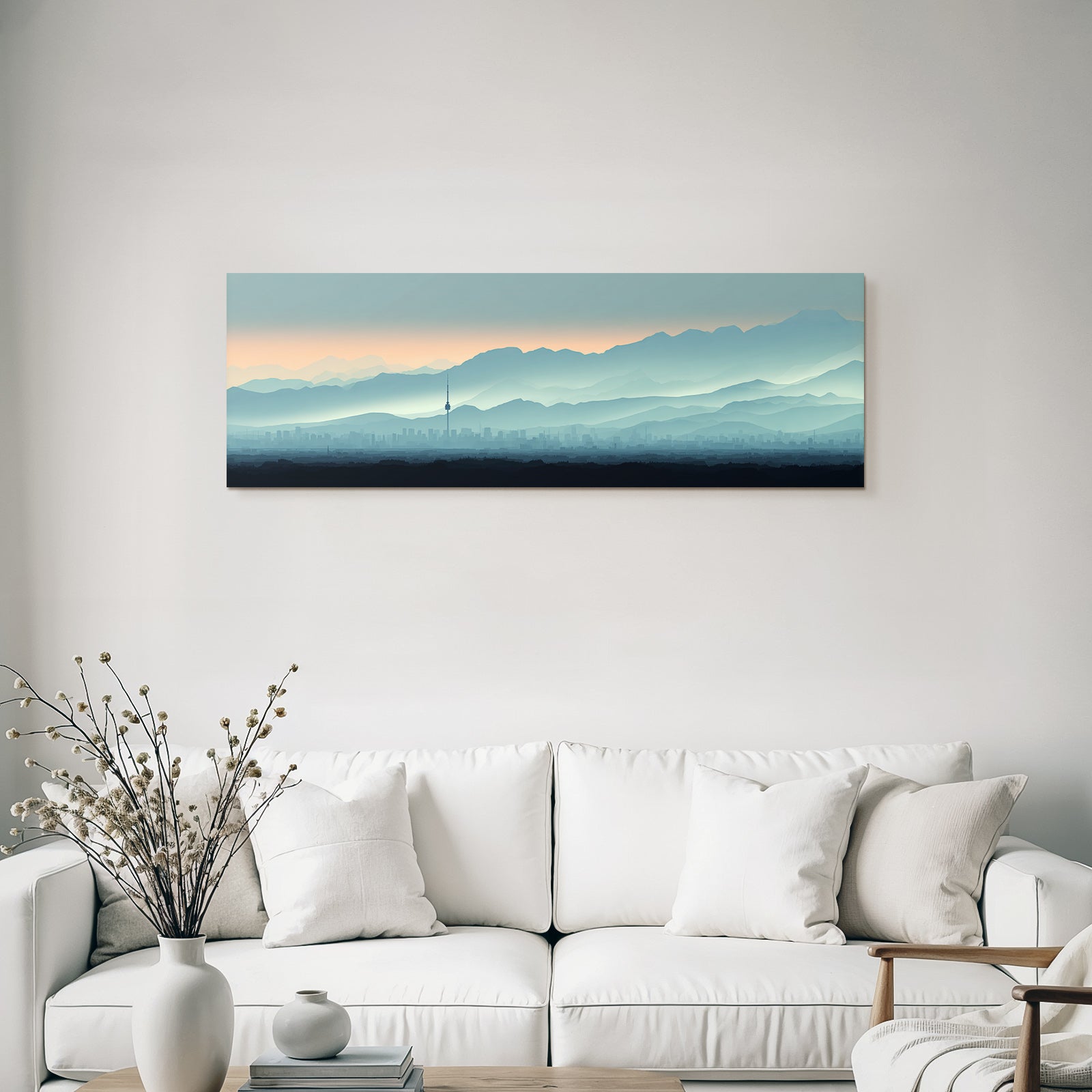 Cityscape with tower and mountain backdrop at sunrise