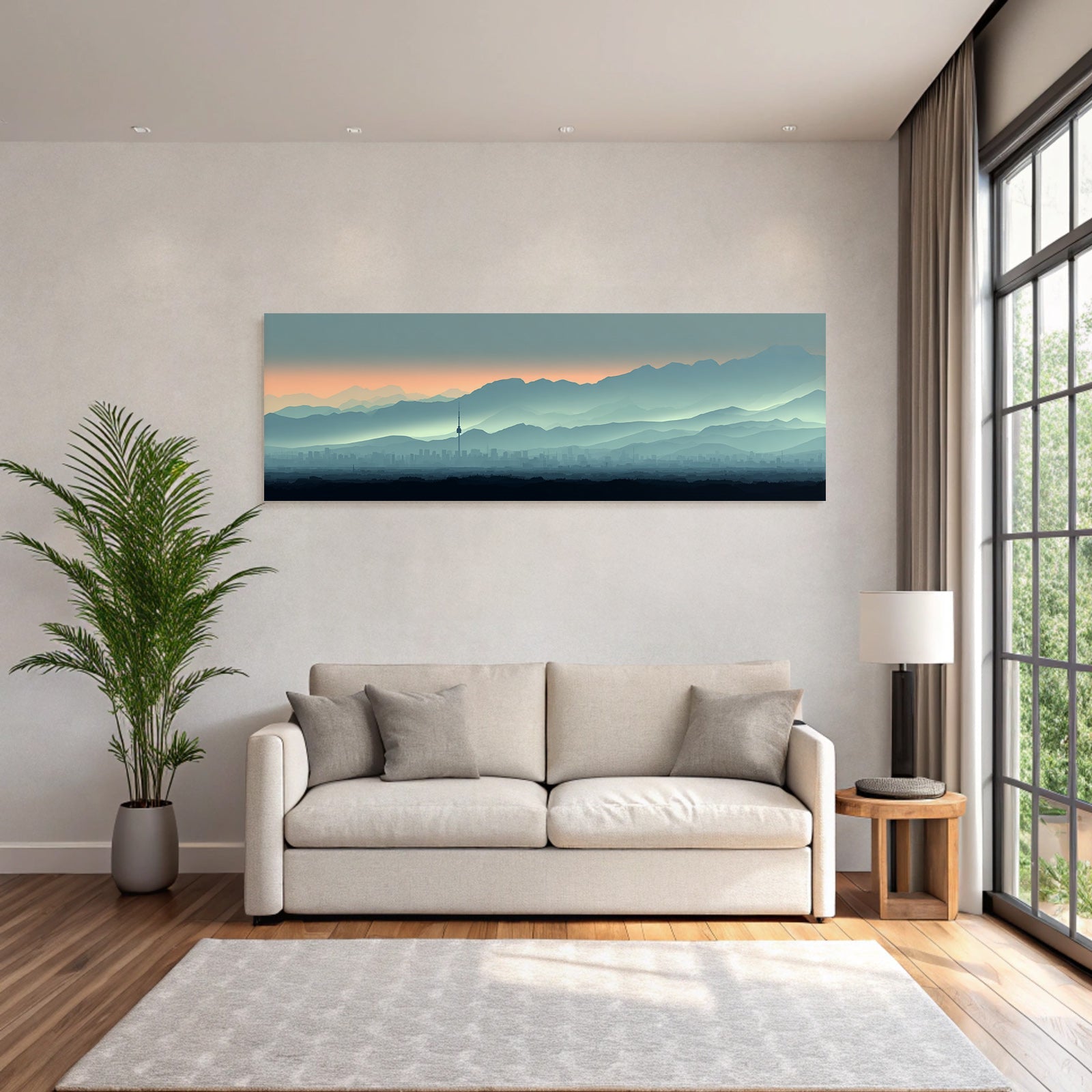 Cityscape with tower and mountain backdrop at sunrise