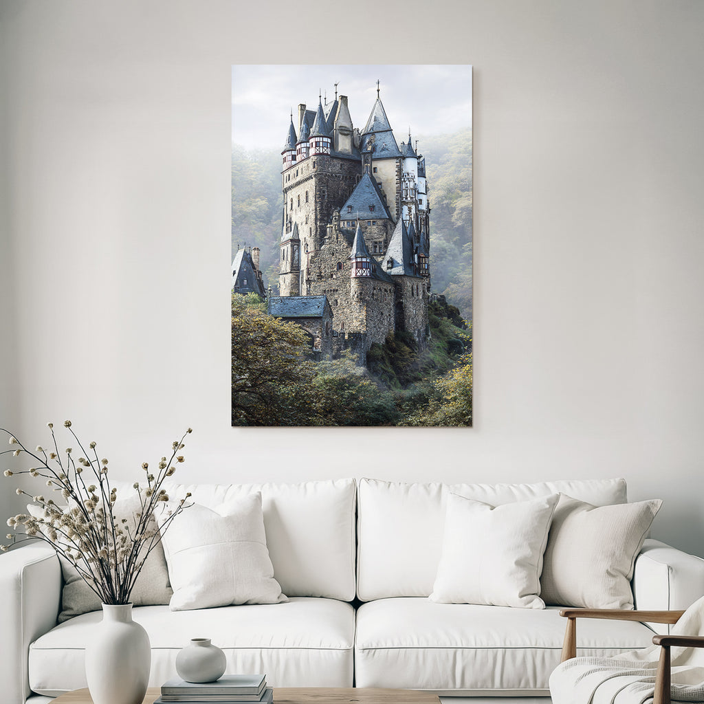 Picturesque castle with peaks surrounded by green landscape