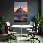 Castle or abbey on island at sunset, reflection in water