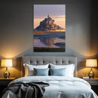 Castle or abbey on island at sunset, reflection in water