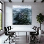 Castle on the mountain surrounded by forest and fog