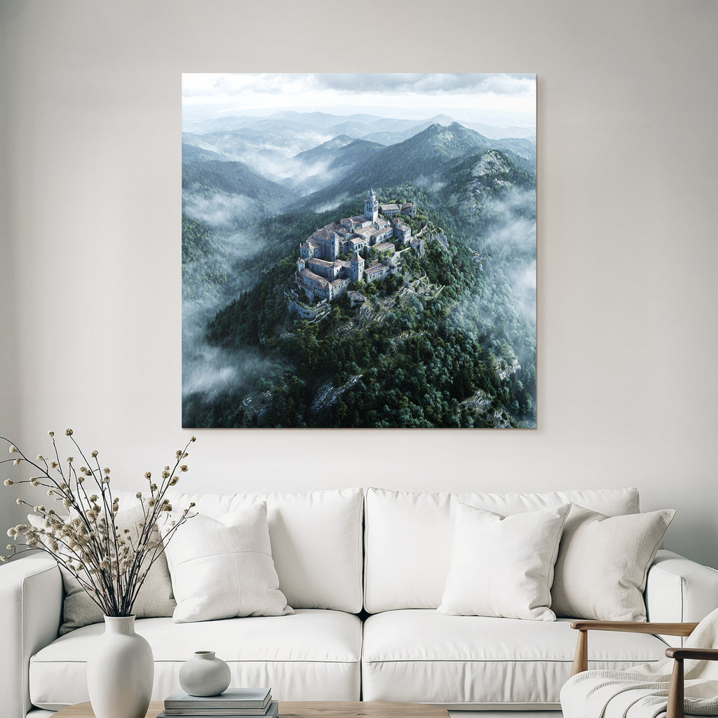 Castle on the mountain surrounded by forest and fog