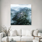 Castle on the mountain surrounded by forest and fog