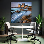 Coastal stone building with towers and calming wash on the horizon