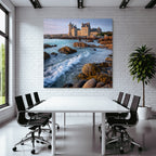 Coastal stone building with towers and calming wash on the horizon