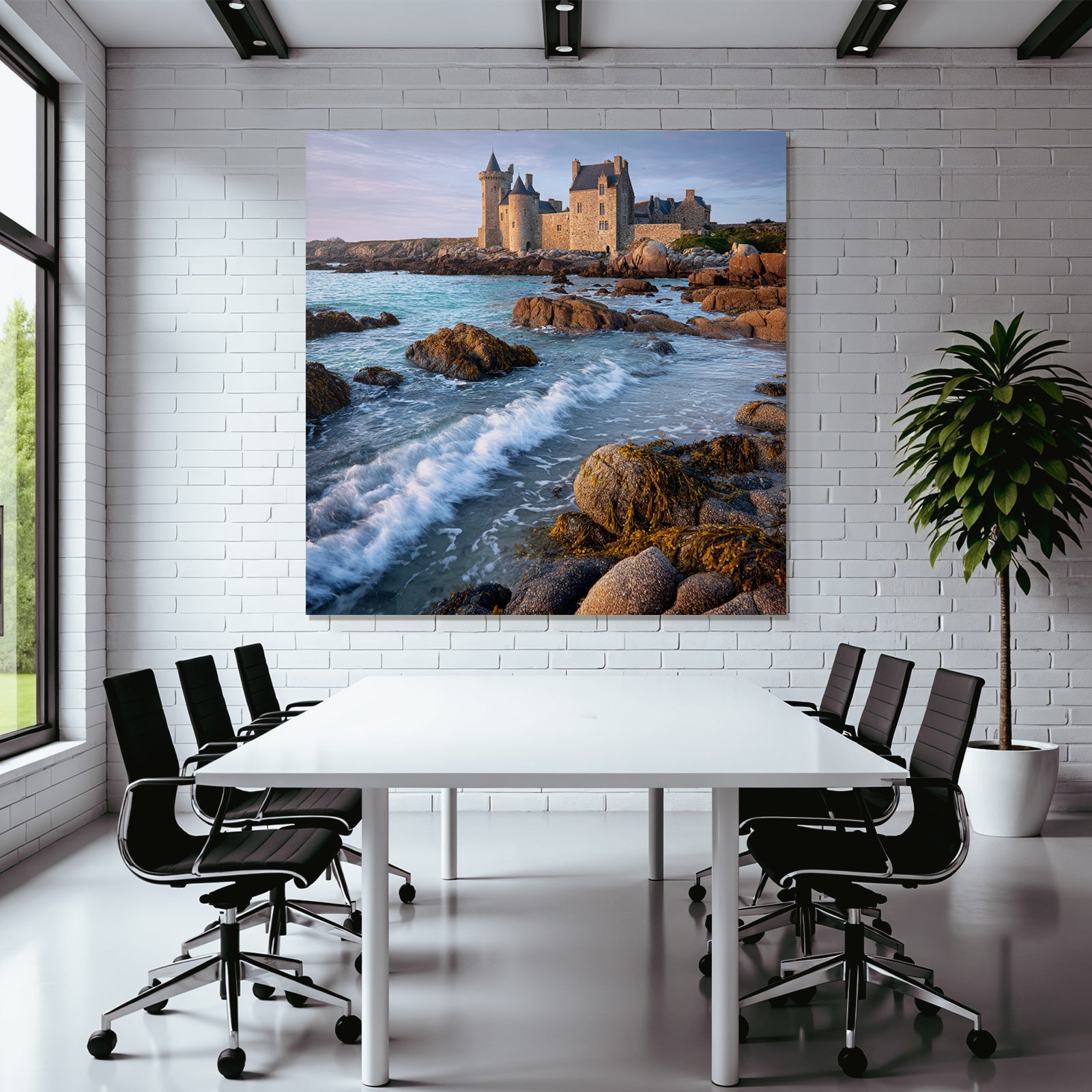 Coastal stone building with towers and calming wash on the horizon