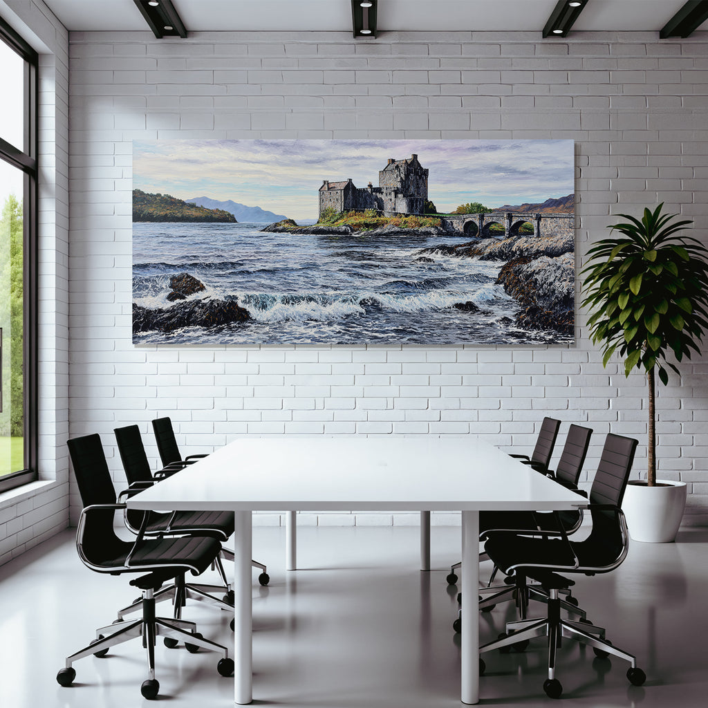 Castle on rock by the sea with bridge and mountains in the background