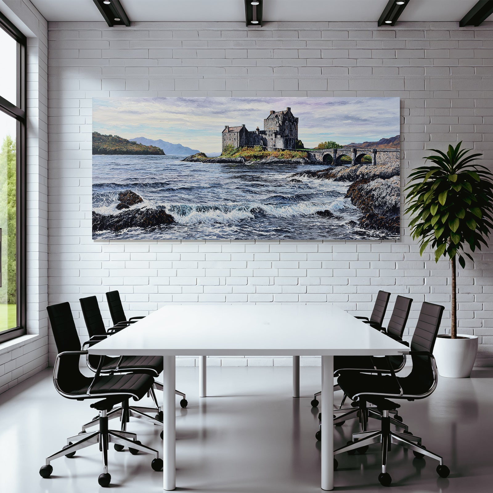 Castle on rock by the sea with bridge and mountains in the background