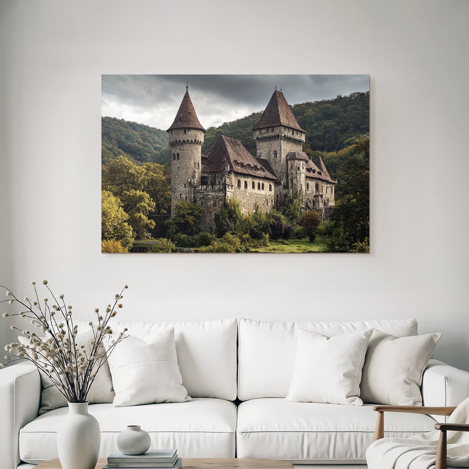 Historic castle with tower in the green under a gloomy sky