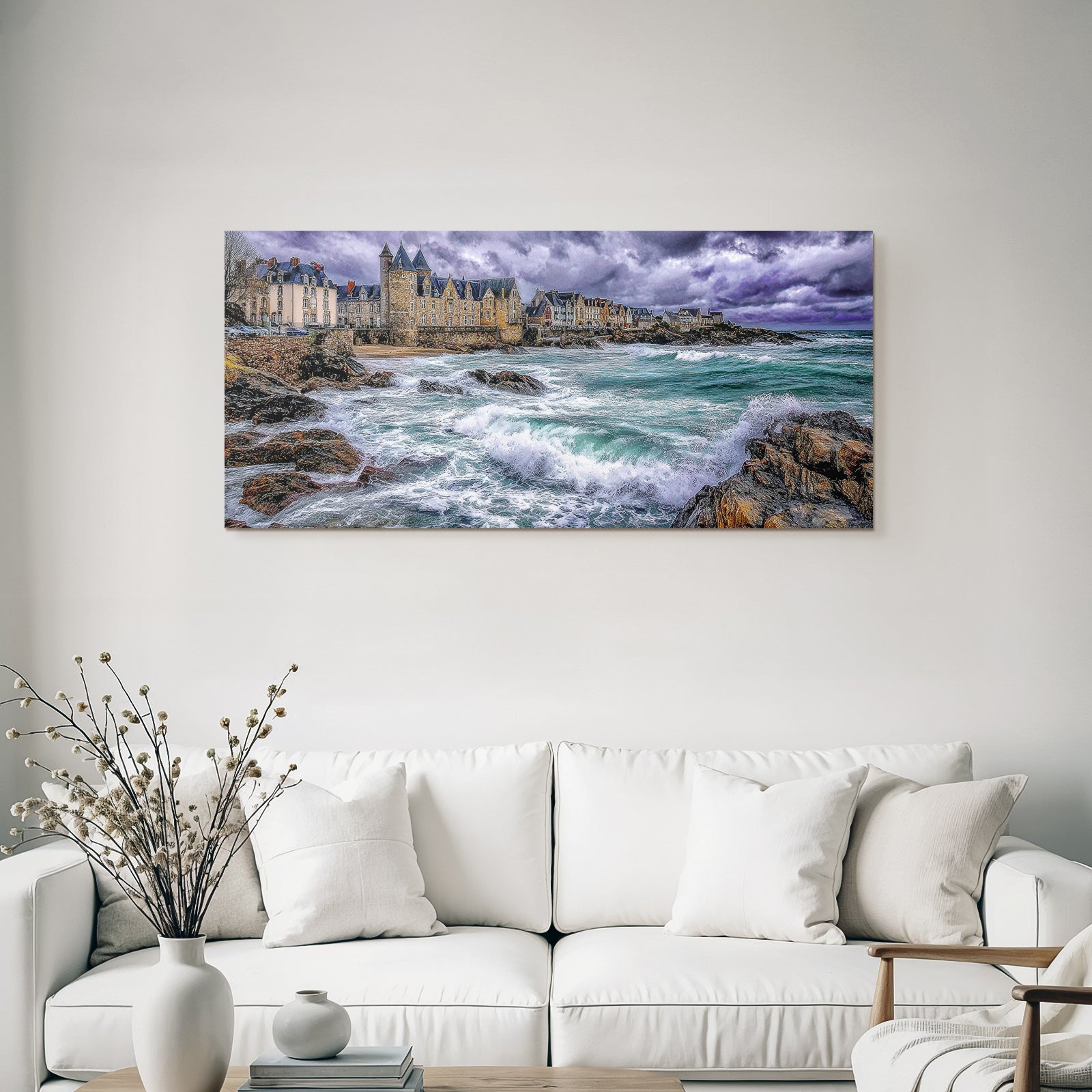 Coastal landscape with rocks, waves and old buildings