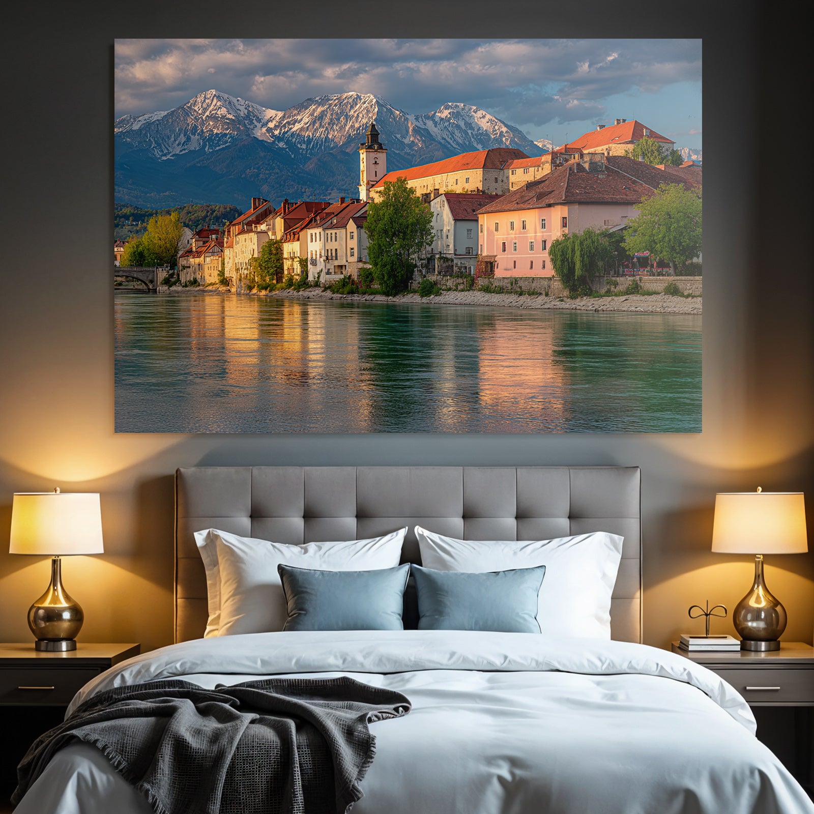 Scenic Riverside View With Red Tiled Roofs And Snow Capped Mountains
