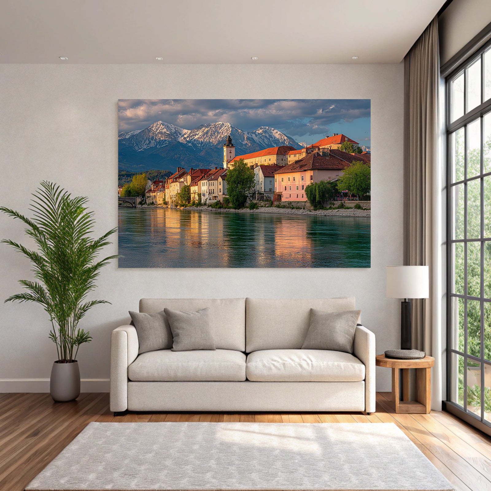 Scenic Riverside View With Red Tiled Roofs And Snow Capped Mountains