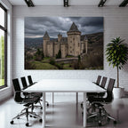Castle in the mountains with trees under a cloudy sky