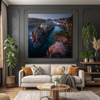 Rocking board with house surrounded by water and green landscape