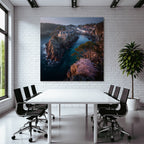 Rocking board with house surrounded by water and green landscape