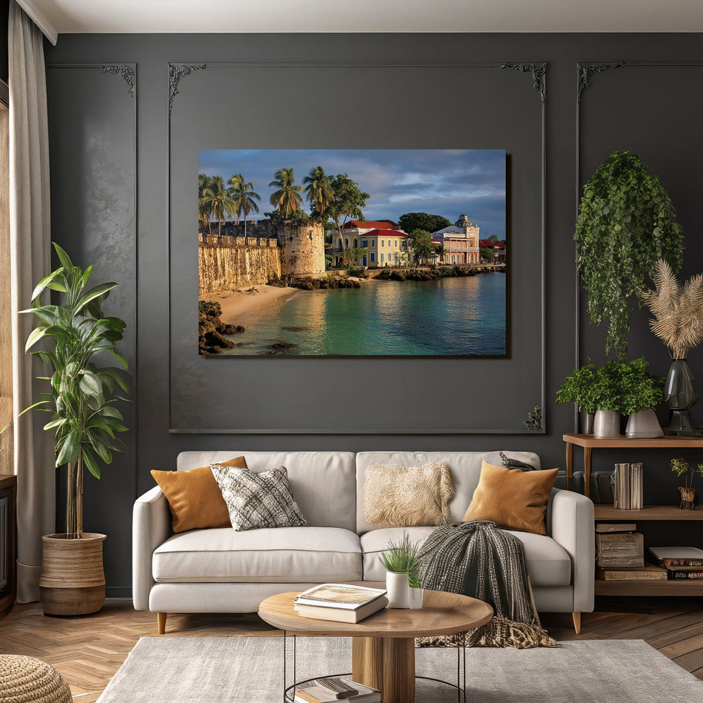 Caribbean island world: historic fortress on the coast with palm trees, colorful houses, and reflecting water