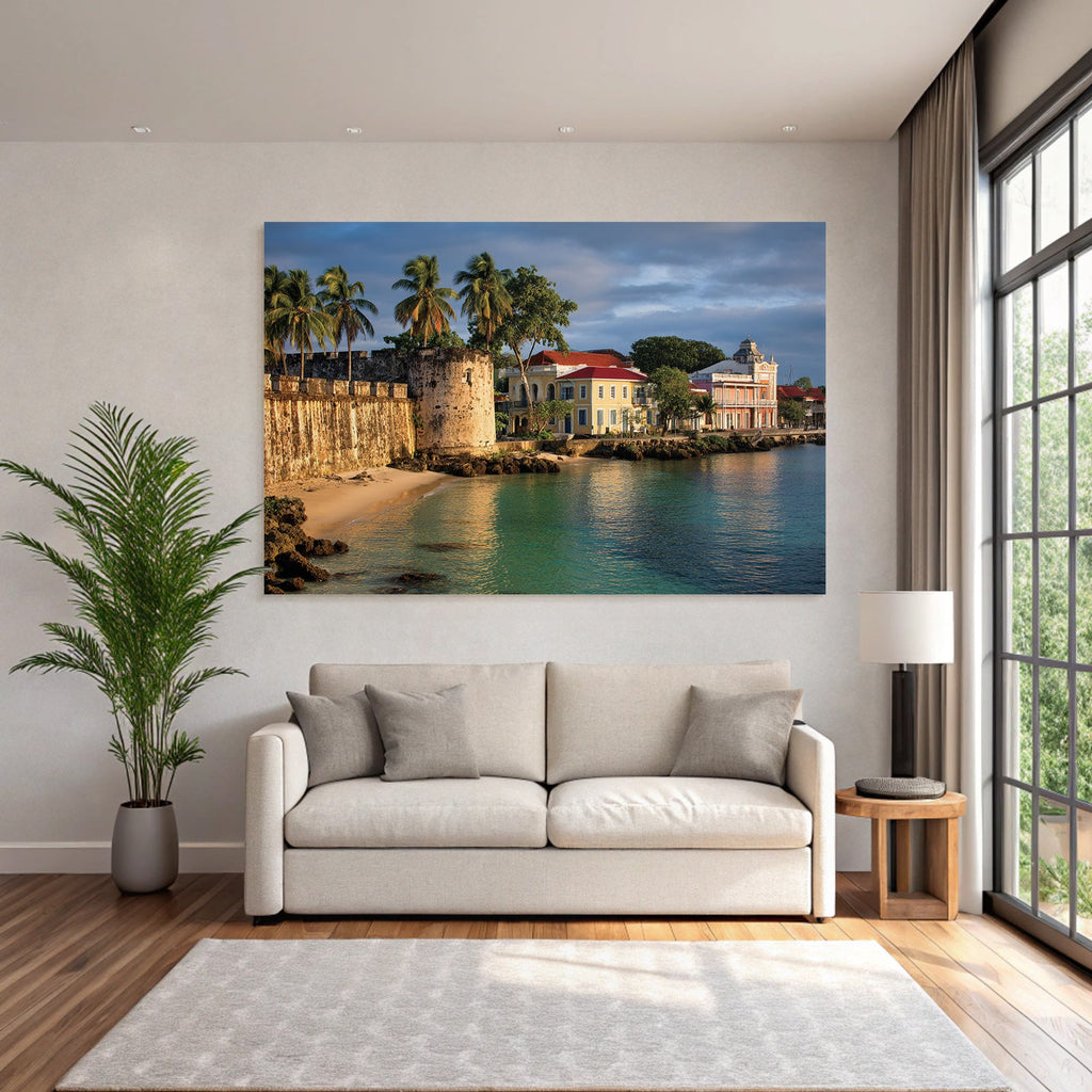 Caribbean island world: historic fortress on the coast with palm trees, colorful houses, and reflecting water