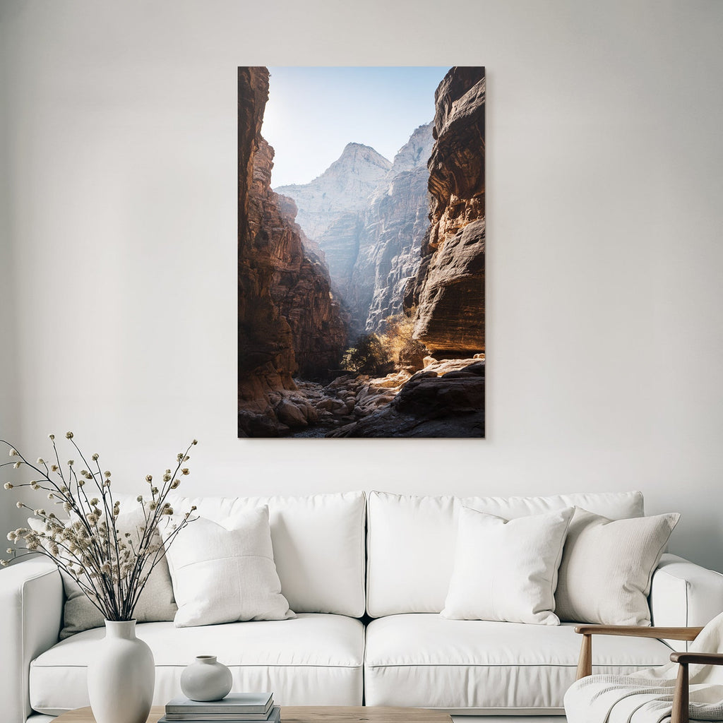 Steep rock walls in a gorge with sunlight