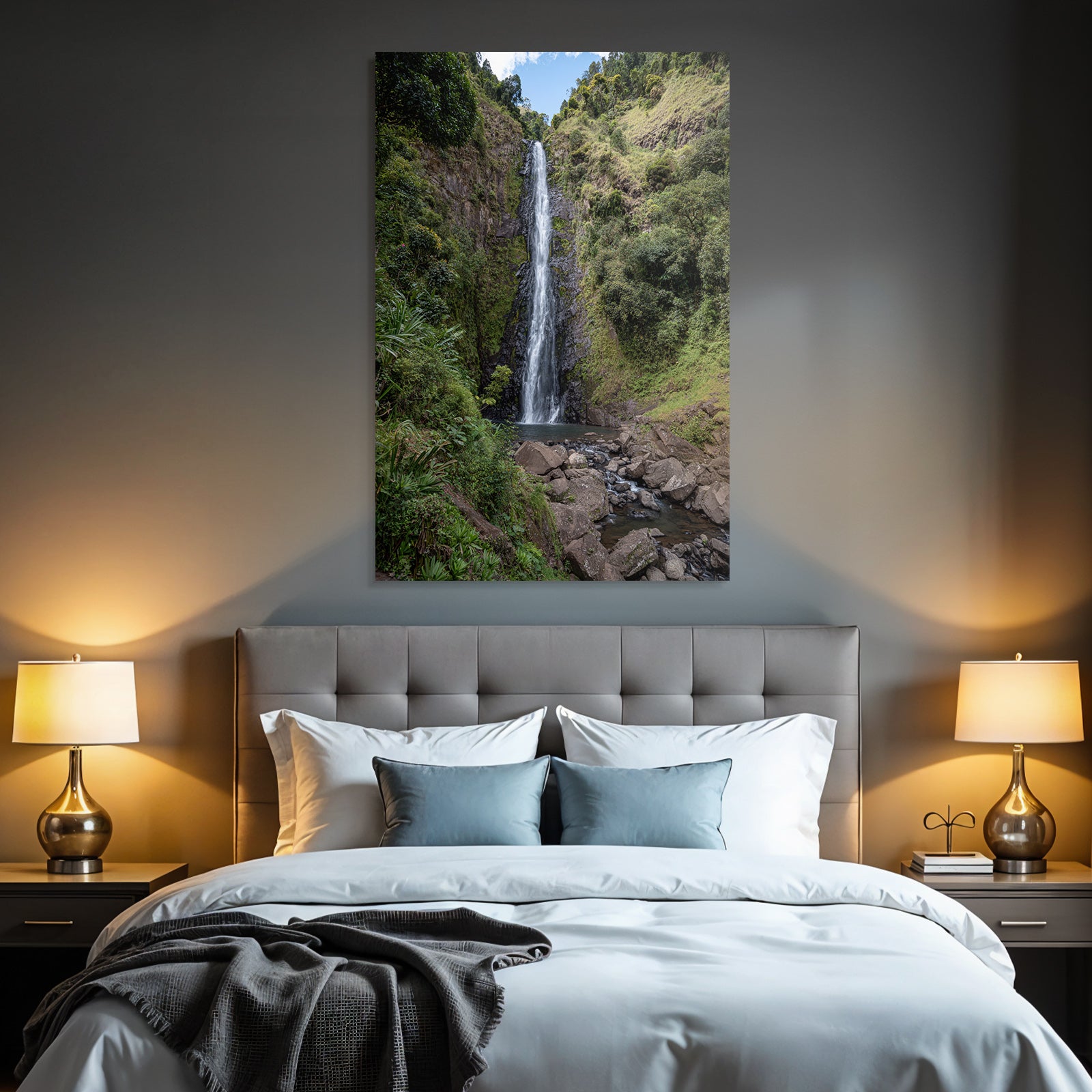Tropical and jungle waterfall surrounded by green terrain and clear skies