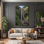 Tropical and jungle waterfall surrounded by green terrain and clear skies