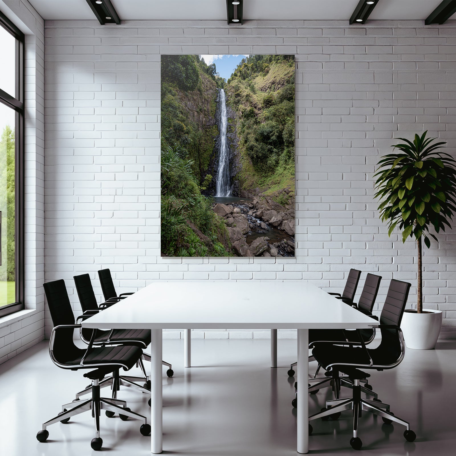 Tropical and jungle waterfall surrounded by green terrain and clear skies