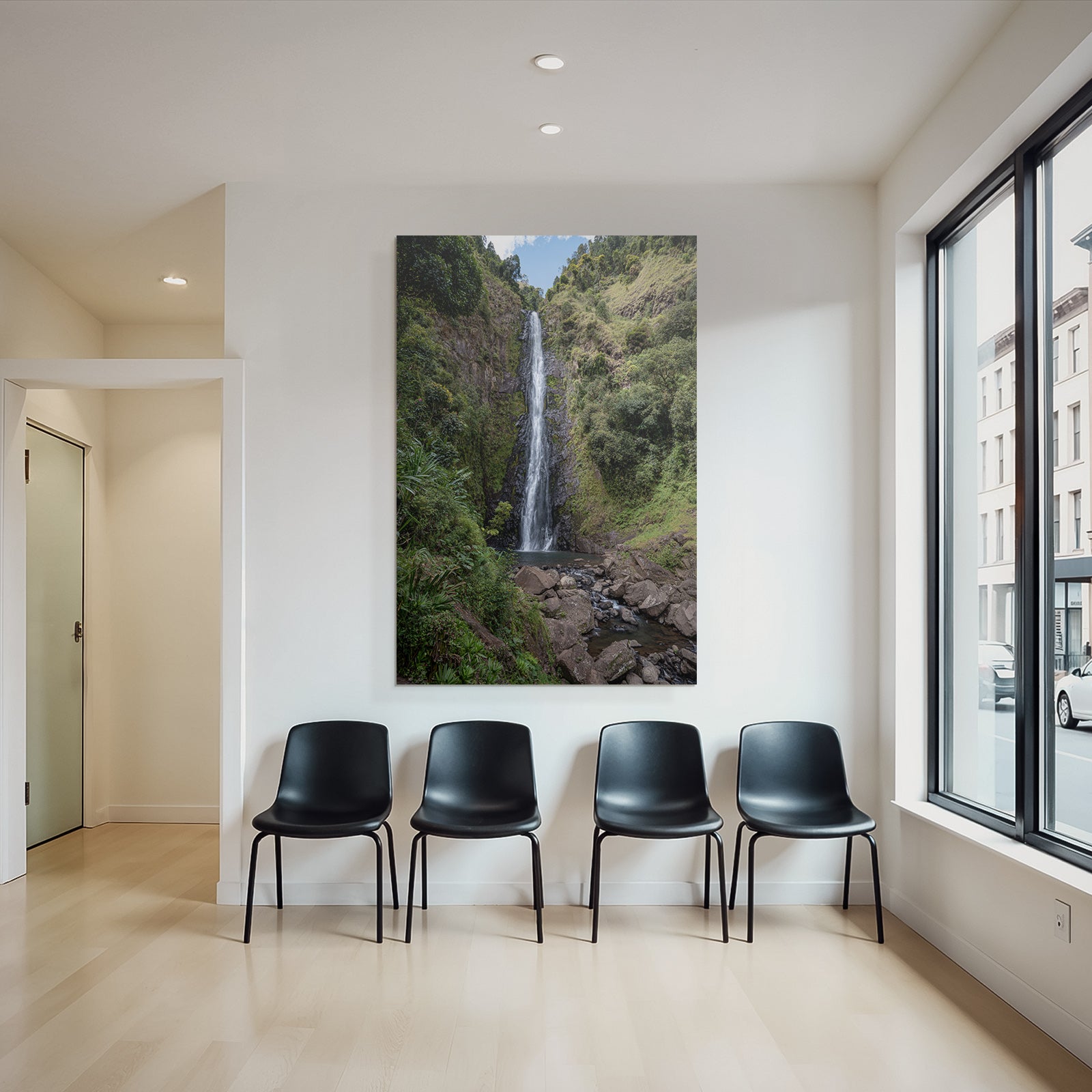 Tropical and jungle waterfall surrounded by green terrain and clear skies