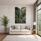 Tropical and jungle waterfall surrounded by green terrain and clear skies