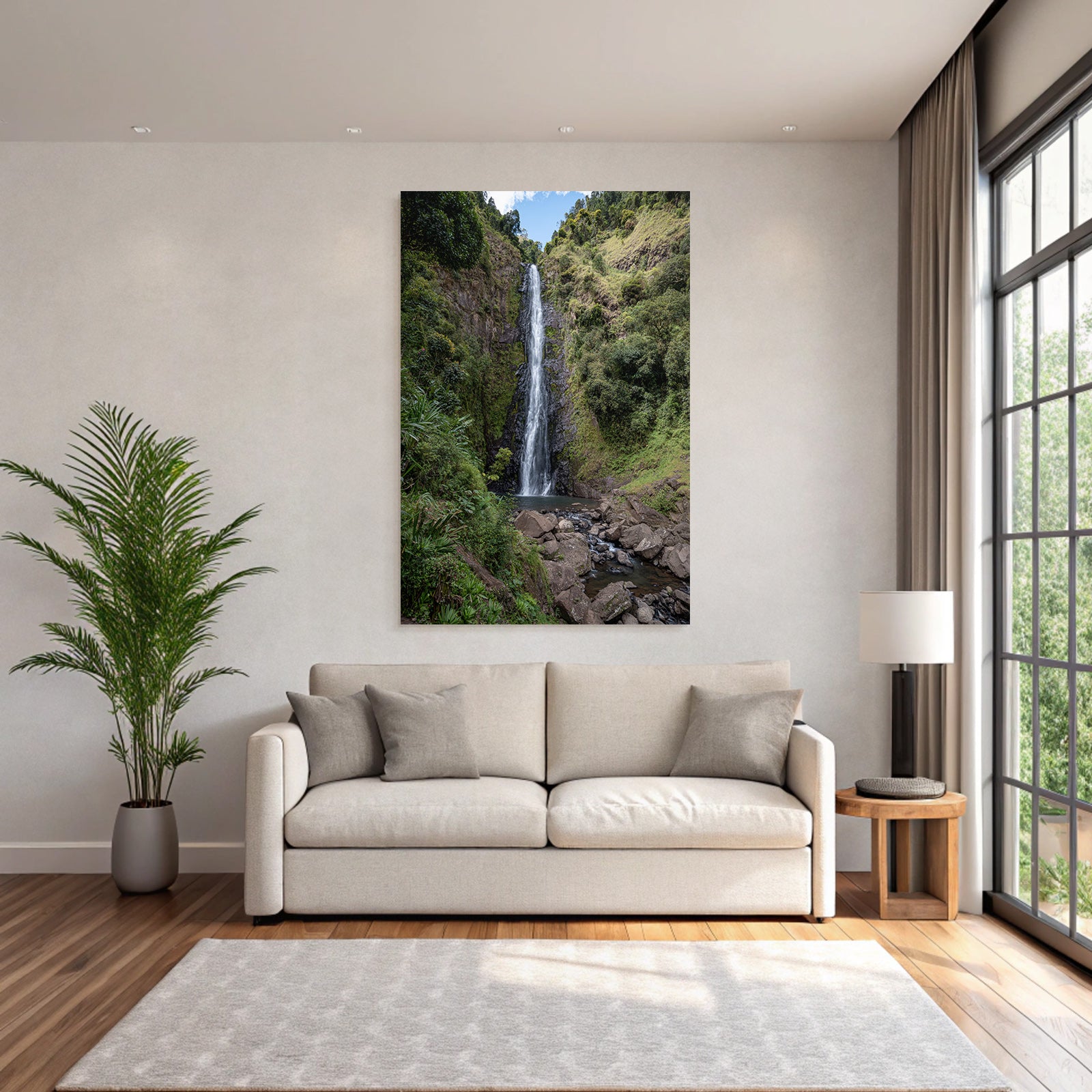 Tropical and jungle waterfall surrounded by green terrain and clear skies