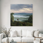 Tropics and jungle person on hill overlooking country landscape with mountains and mist