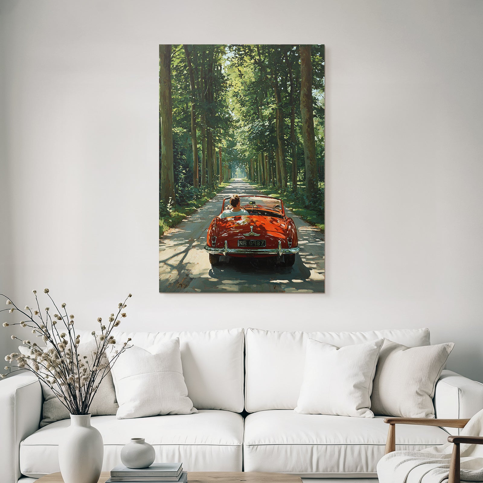 Forests and meadows Red convertible drive on a tree-lined road