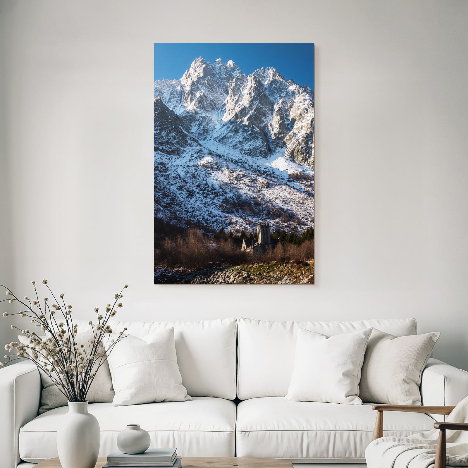 Winter mountain landscape with stony church and trees