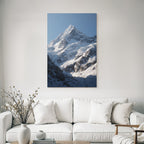 Winter Majestic Snow-capped Mountain Peak Under a Clear Blue Sky