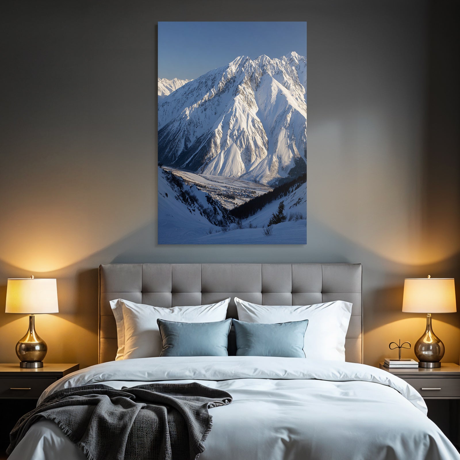 Winter snow-covered mountain landscape with valley and village in the foreground