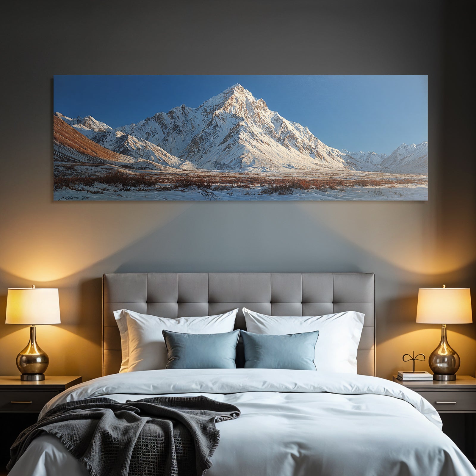 Winter mountain landscape with snow-capped peaks and blue sky