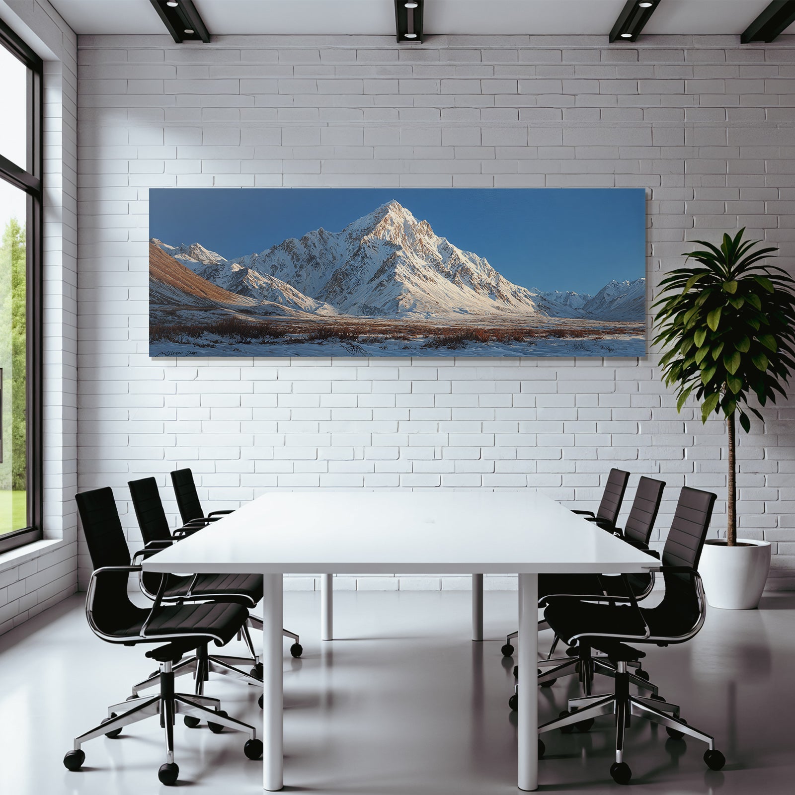 Winter mountain landscape with snow-capped peaks and blue sky