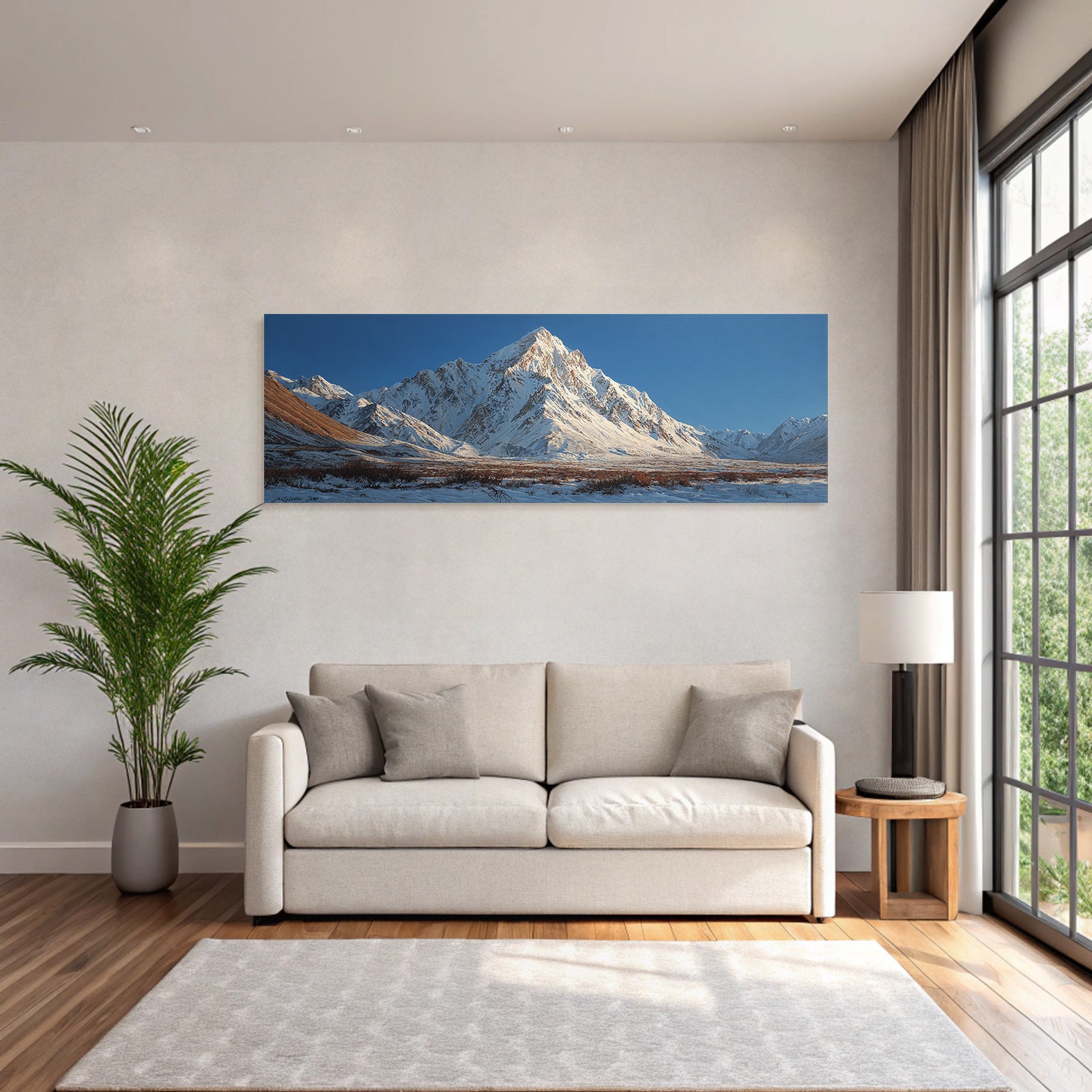 Winter mountain landscape with snow-capped peaks and blue sky