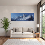 Winter snow-capped mountains against a clear blue sky