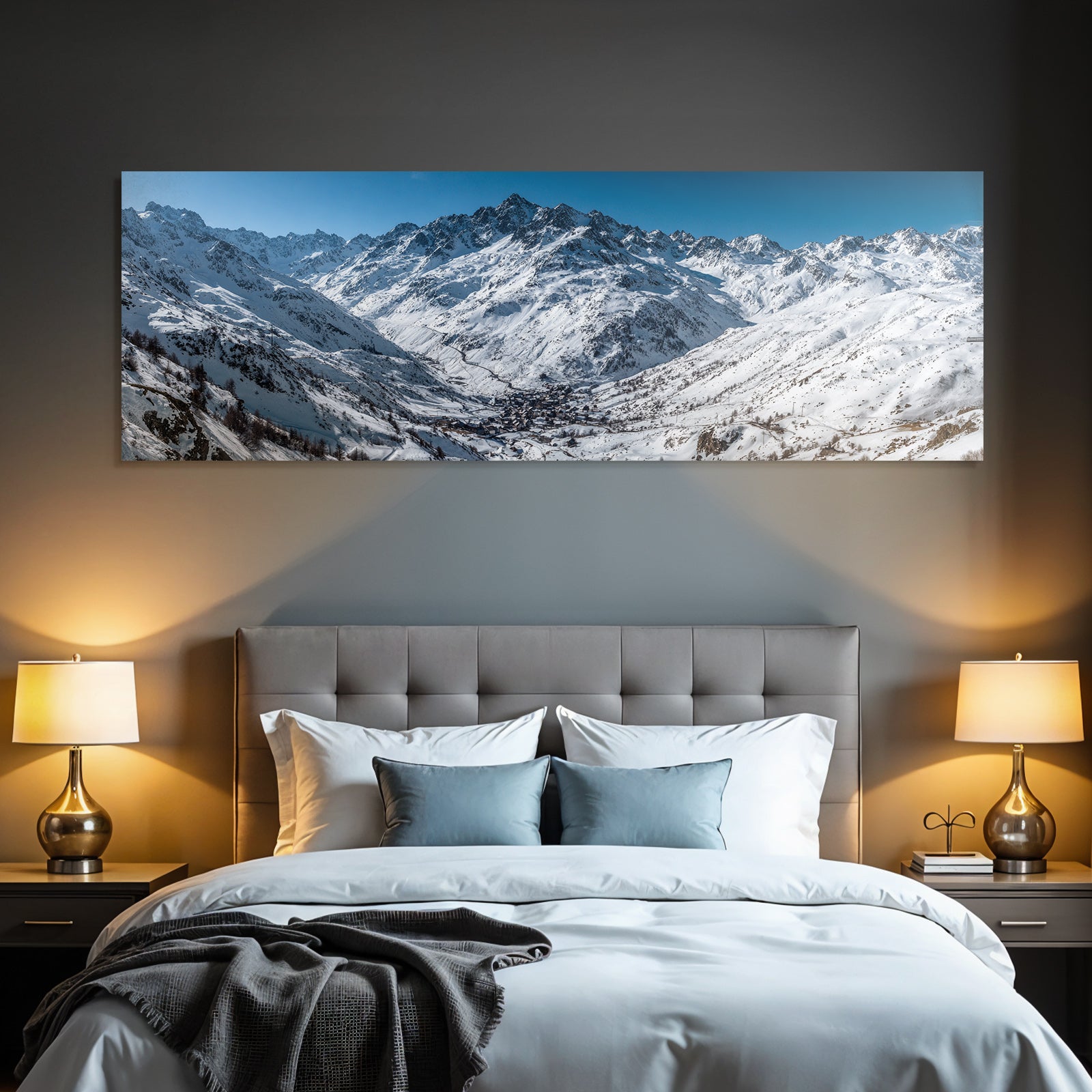 Winter snow-covered mountain landscape with village under blue sky