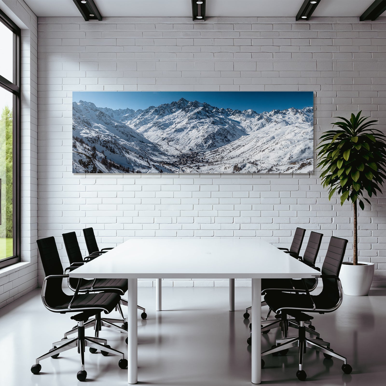 Winter snow-covered mountain landscape with village under blue sky