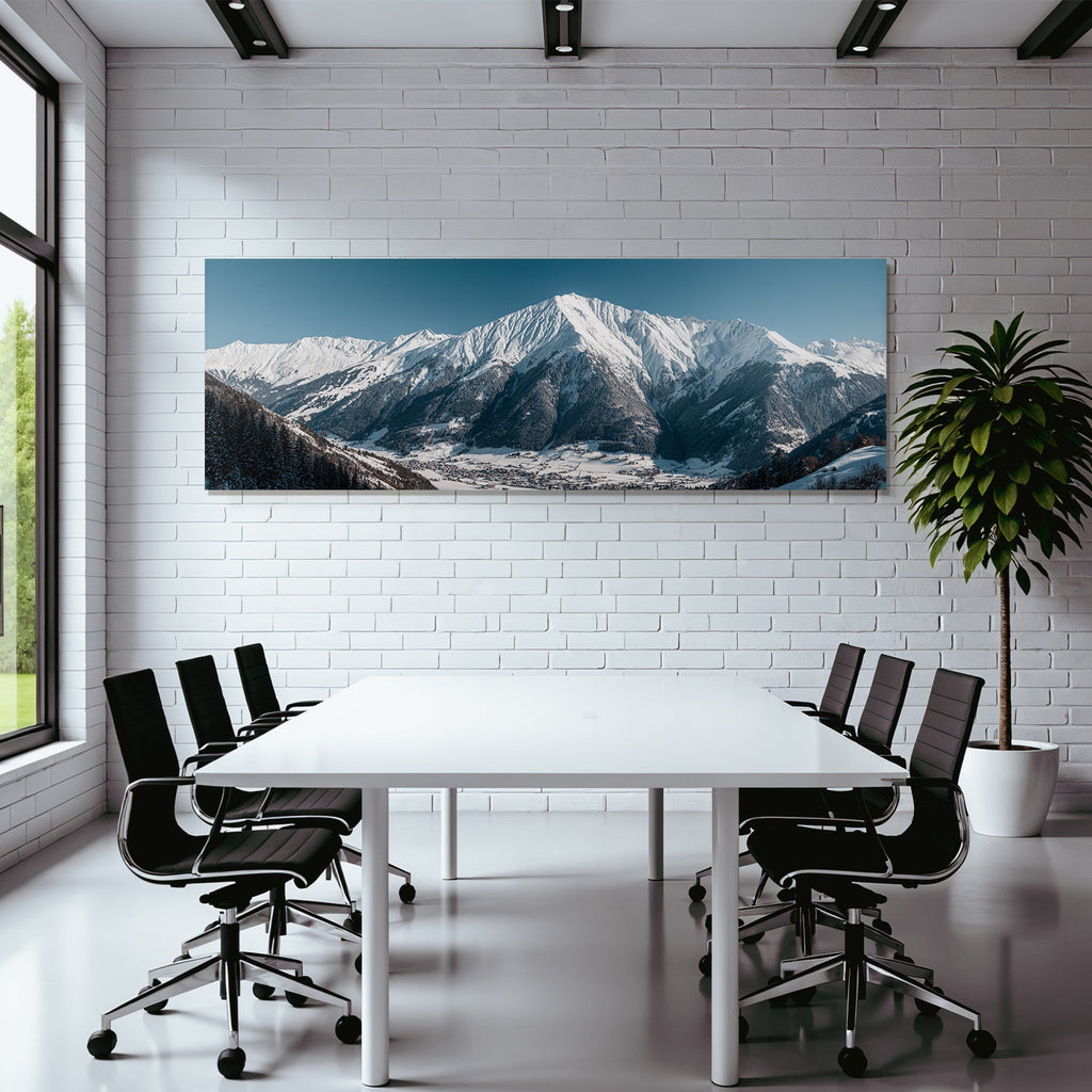 Winter of snow-capped mountains with village in the valley