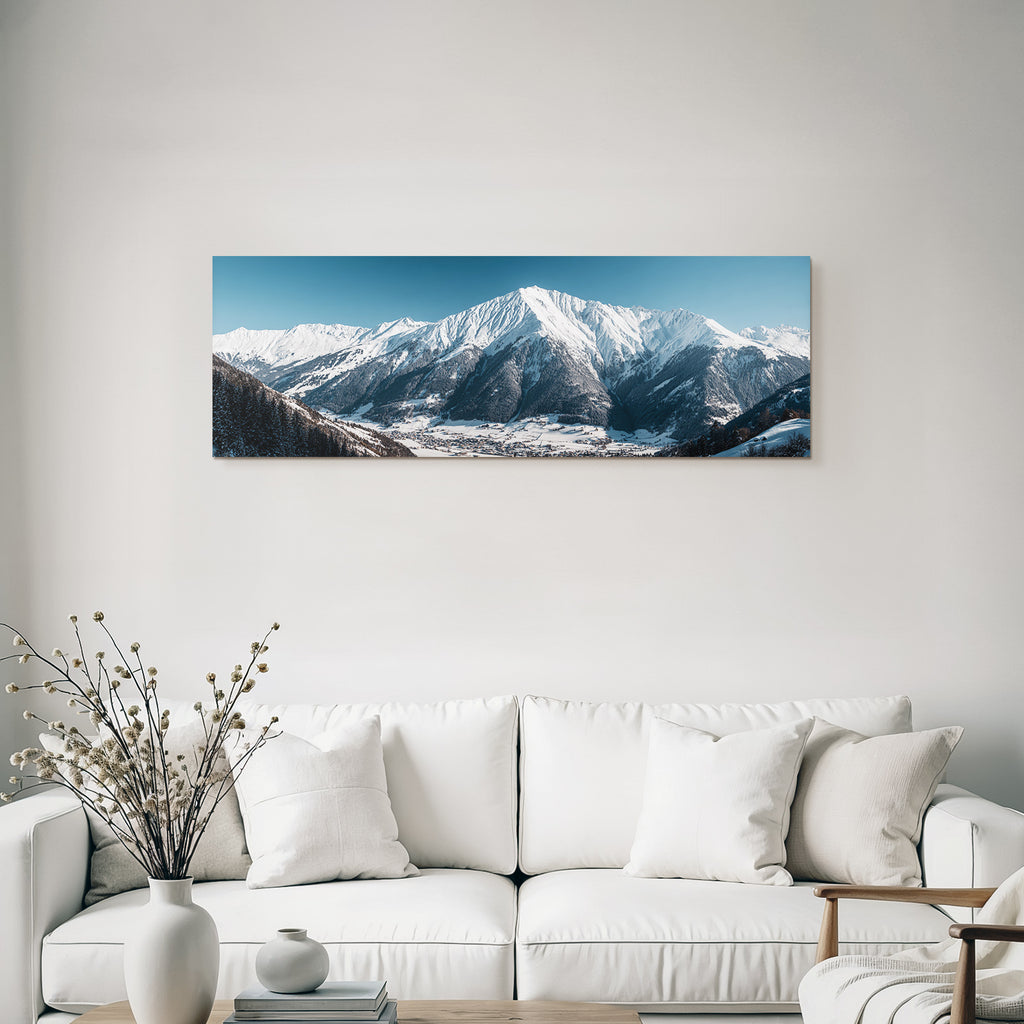 Winter of snow-capped mountains with village in the valley