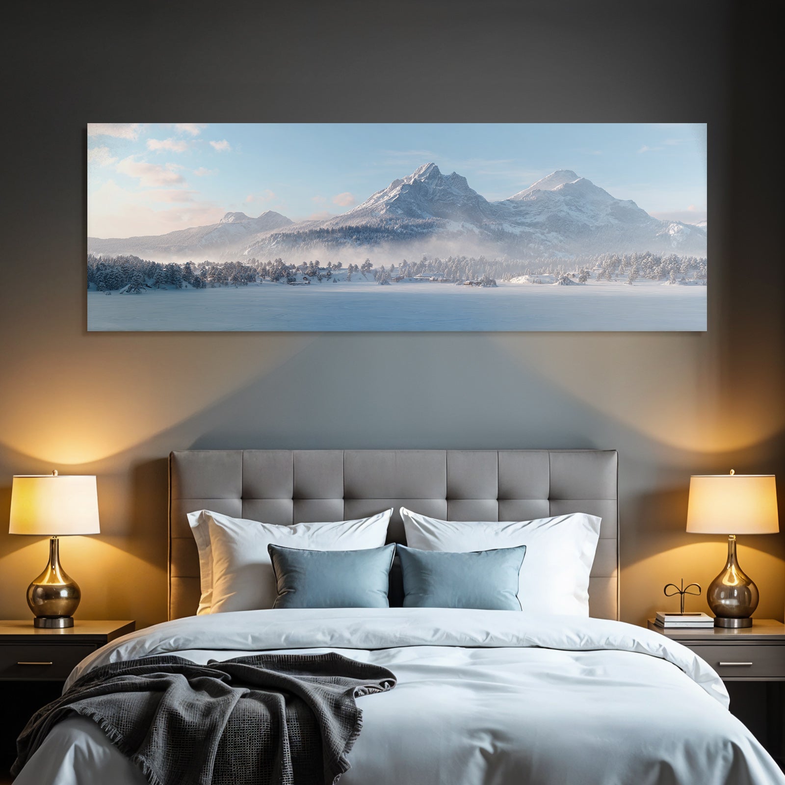 Winter landscape with snow-capped mountains and forest under blue sky