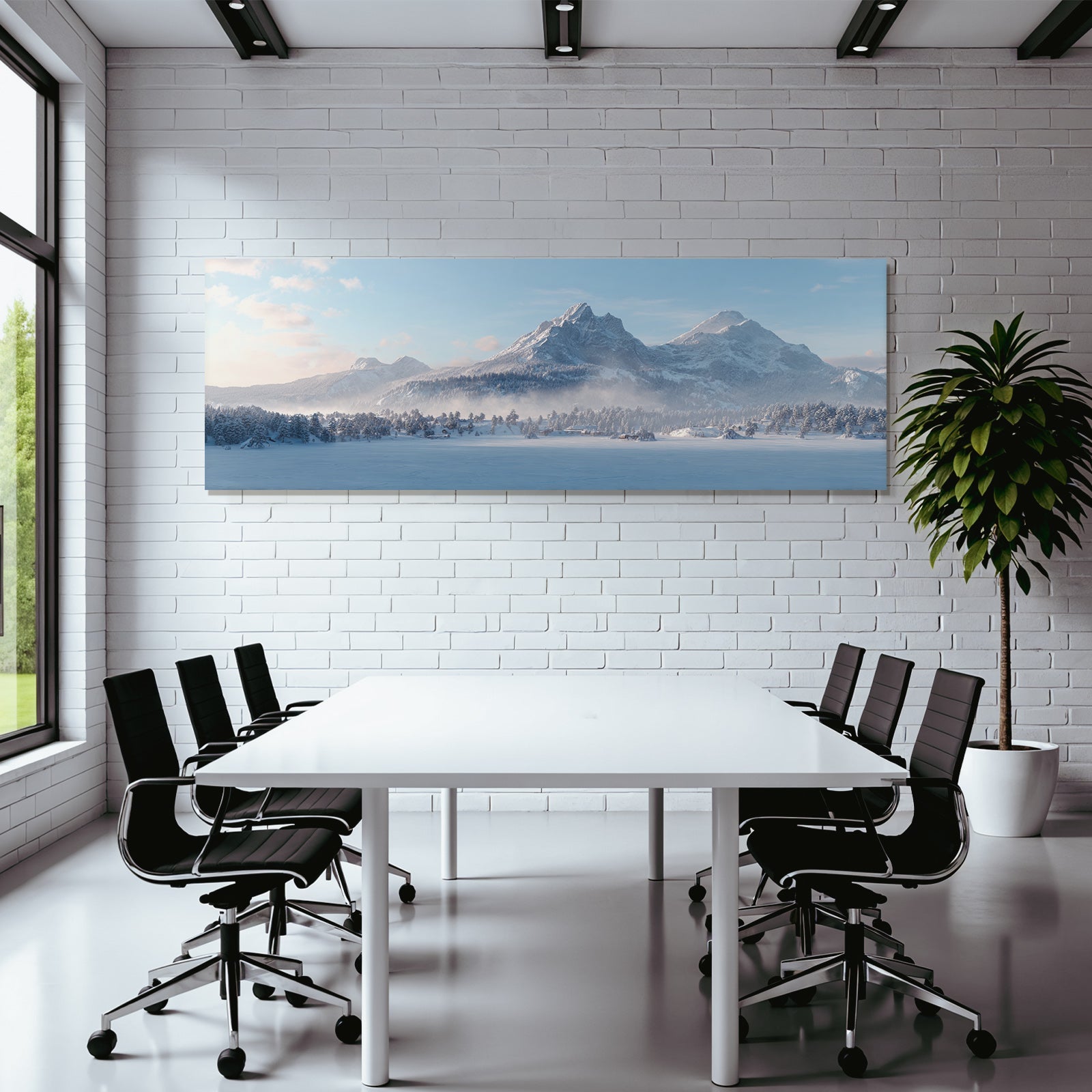 Winter landscape with snow-capped mountains and forest under blue sky