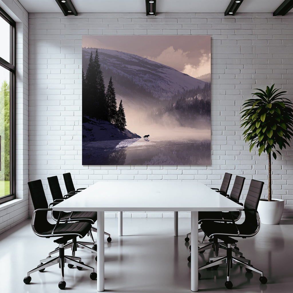 Winter tranquil snowy landscape with wolf at water's edge
