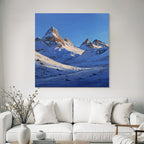 Winter snow-covered mountain landscape under a clear blue sky