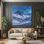 Winter landscape with snow-capped mountains and clear sky