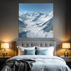 Winter landscape with snow-capped mountains and glaciers and blue sky