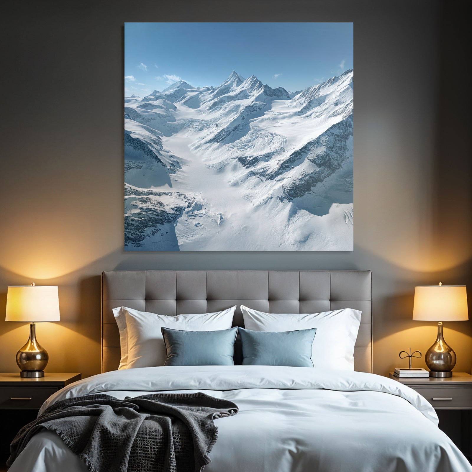 Winter landscape with snow-capped mountains and glaciers and blue sky
